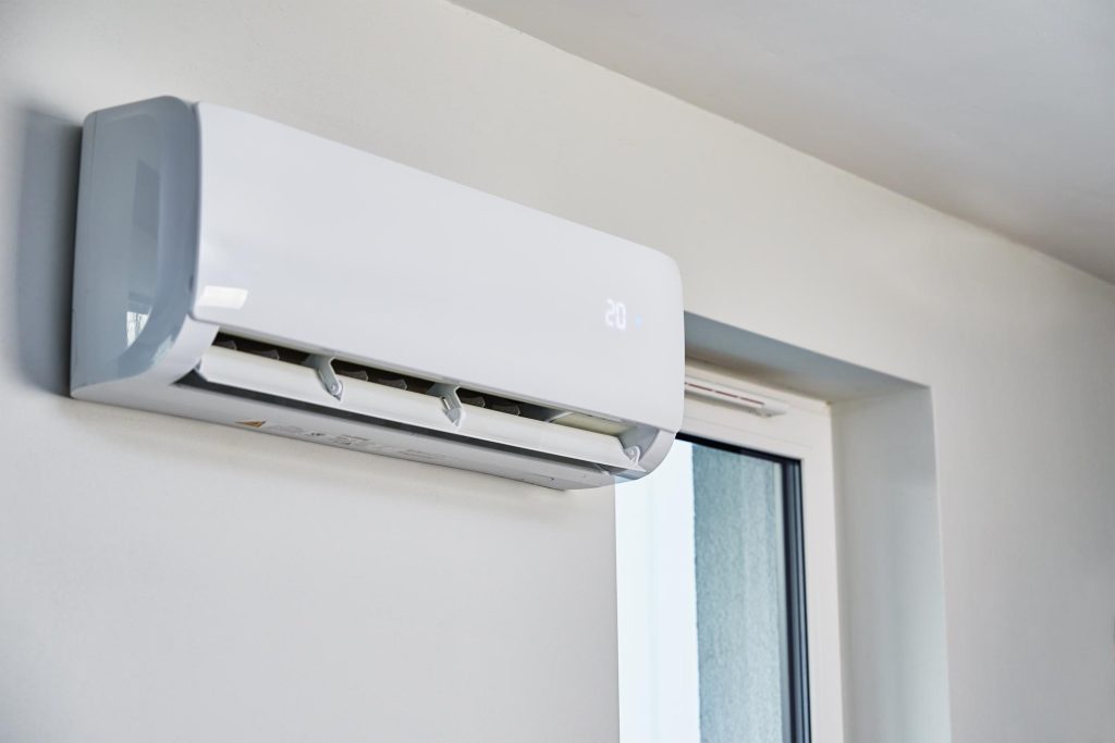 Wall-mounted air conditioning unit installed in a modern property.